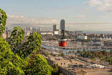historic red cable car, towers, harbor and city panorama of Barcelona, spainの写真素材