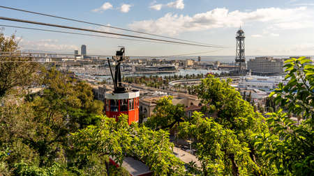 view on historic red cable car cabin and steel tower at the harbor of Barcelona, spainの写真素材