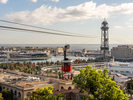 view on historic red cable car cabin and steel tower at the harbor of Barcelona, spainの写真素材