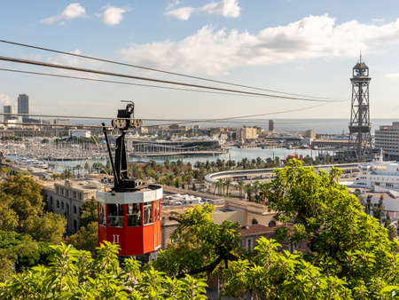 view on historic red cable car cabin and steel tower at the harbor of Barcelona, spainの写真素材