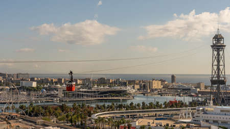 historic cable car, towers, harbor and city panorama of Barcelona, spainの写真素材