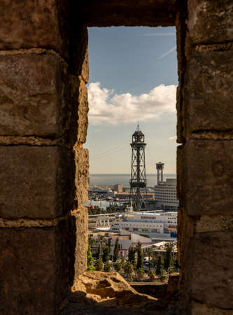 view on historic cable car and steel towers at harbor of catalan city Barcelona, spainの写真素材