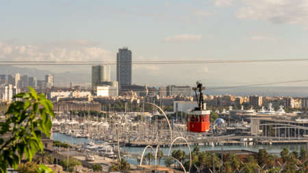 historic red cable car, towers, harbor and city panorama of Barcelona, spainの写真素材