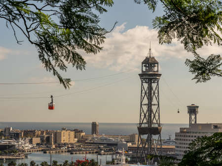 historic cable car, towers, harbor and city panorama of Barcelona, spainの写真素材