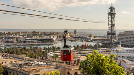 view on historic red cable car cabin and steel tower at the harbor of Barcelona, spainの写真素材