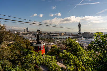 view on historic red cable car cabin and steel tower at the harbor of Barcelona, spainの写真素材