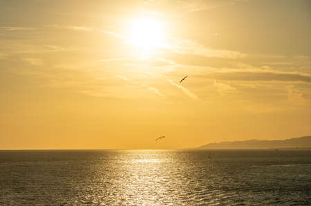 view of a golden sunset at Barcelona waterfront, spainの写真素材
