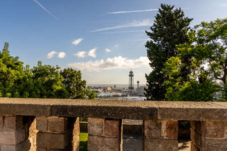 view on historic cable car and steel towers at harbor of catalan city Barcelona, spainの写真素材