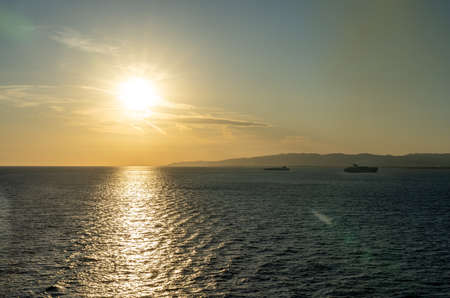 view of a golden sunset at Barcelona waterfront, spainの写真素材