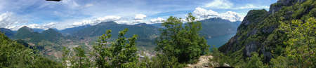 Panoramic viuew on Riva del garda from mountain peak of monte colodri, italyの写真素材
