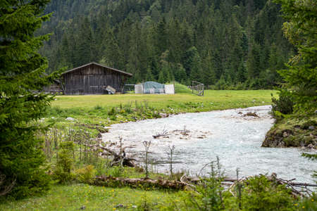 view on isar river and mountains near the isar origin in scharnitz, austriaの写真素材