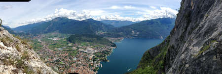 panoramic view on Riva del garda from mountain peak of cima d'oro and the lake of garda in northern italyの写真素材