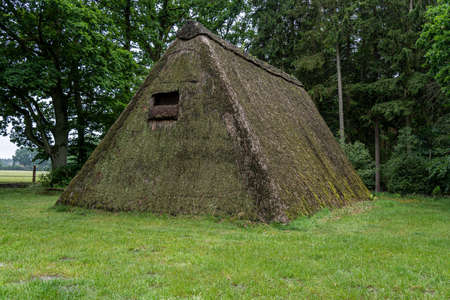 Characteristic stable for German moorland sheep with a straw roof in the natural preserve Lueneburger Heide, Germanyの写真素材