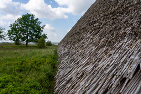 Characteristic stable for German moorland sheep with a straw roof in the natural preserve Lueneburger Heide, Germanyの写真素材