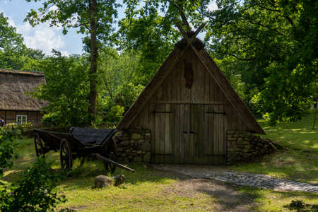 Characteristic stable for German moorland sheep with a straw roof in the natural preserve Lueneburger Heide, Germanyの写真素材
