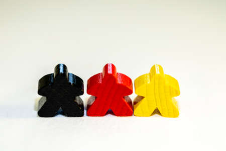 German country and people represented by black, red, yellow figurines made from woodの写真素材