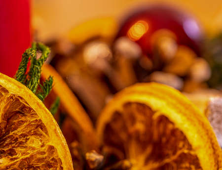Close up of an advent wreath with pine cones, dried orange slices and candlesの写真素材