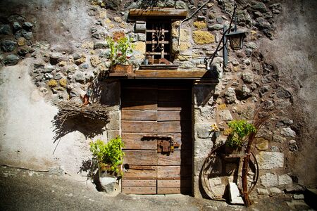 Ancient winery's door in Tuscanyの写真素材