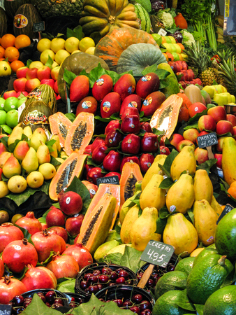 Fruit basket at the Barcelona market with different types of vegetables and fruitsのeditorial素材