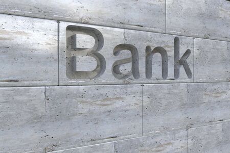 Three dimensional bank letter engraving in stoneの写真素材