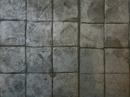 Square rock tiles on the floor dark gray toneの素材