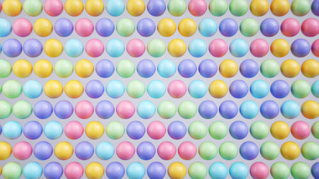 3d render. Abstract background of colorful glossy plastic balls. Cute childish minimal wallpaperの写真素材