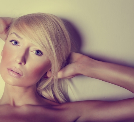 Beauty portrait of blonde young woman looking at camera.の写真素材
