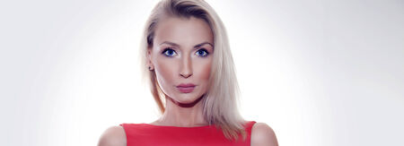 Closeup portrait of young blond female   Beautiful girl looking at camera  の写真素材