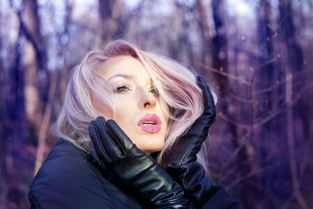 Portrait of beautiful blonde girl. Outdoor photo, autumn.の写真素材