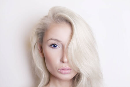 Beauty portrait of young blonde woman looking at camera.の写真素材