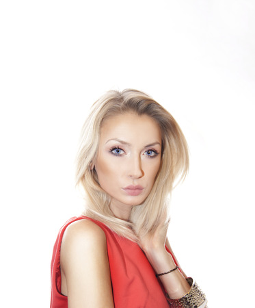 Portrait of beautiful attractive blonde woman with perfect makeup looking at camera.の写真素材