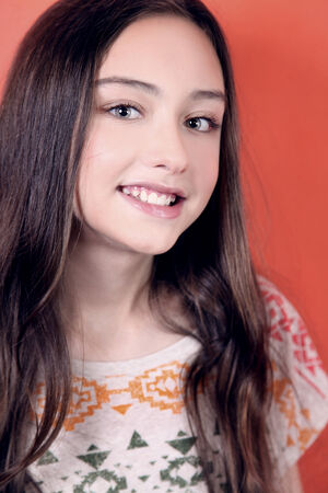 Beauty portrait of smiling young teenager girl looking at camera.の写真素材