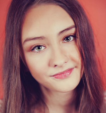 Closeup portrait of young brunette teenager girl looking at camera.の写真素材