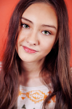 Closeup portrait of young brunette teenager girl looking at camera.の写真素材