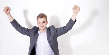 Triumphing businessman looking at camera.の写真素材