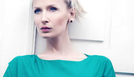 Beauty portrait of attractive blonde woman with blue eyes.の写真素材