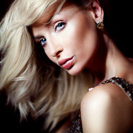 Sexy beautiful blonde woman looking at camera. Beauty portrait.Elegant lady.の写真素材