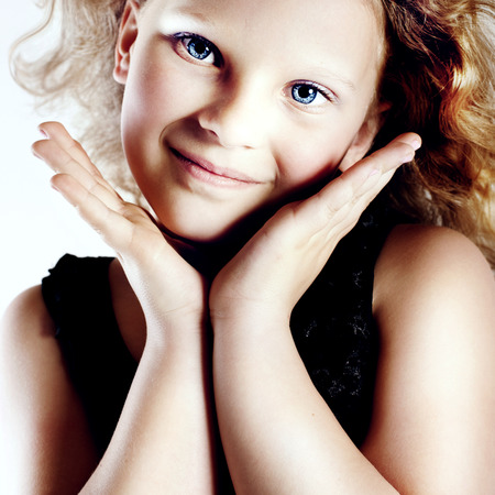 Cute little smiling girl posing , looking at camera.の写真素材