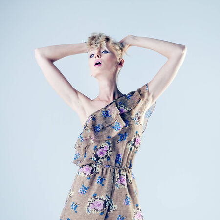 Fashionable attractive beautiful blonde woman posing in studio. の写真素材