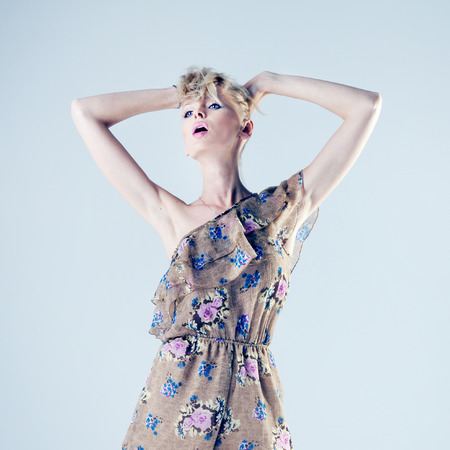 Fashionable attractive beautiful blonde woman posing in studio. の写真素材