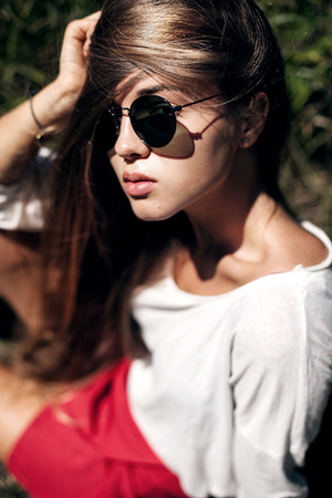 Beauty portrait of young teenage girl wearing sunglassesの写真素材