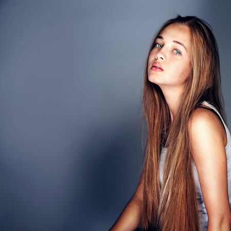 Beauty portrait of young teenage girl with long healthy hair. Studio shotの写真素材