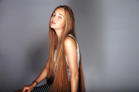 Beauty portrait of young teenage girl with long healthy hairの写真素材