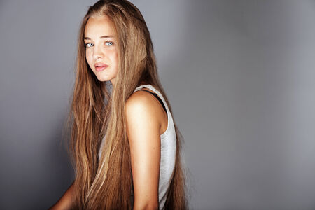 Beauty portrait of young teenage girl with long healthy hairの写真素材