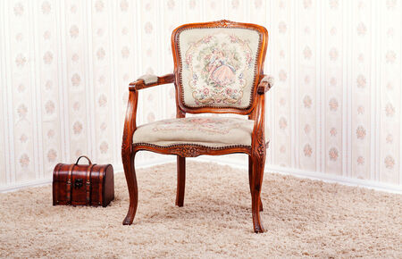 Vintage room vith wallpaper and old antique armchair.の写真素材