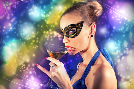 Beautiful happy woman posing in carnival mask. Celebrating time.の写真素材