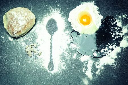 Baking background with raw eggs, bread and flour.の写真素材