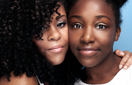 Closeup beauty portrait of young african american girls with glamour makeup.