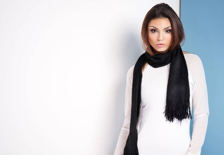 Fashionable young brunette girl looking at camera. Woman with long healthy hair.の写真素材