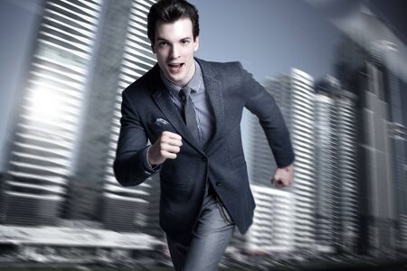 Young handsome businessman posing in office . Elegant style.の写真素材